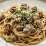 Pasta topped with creamy mushroom sauce and herbs